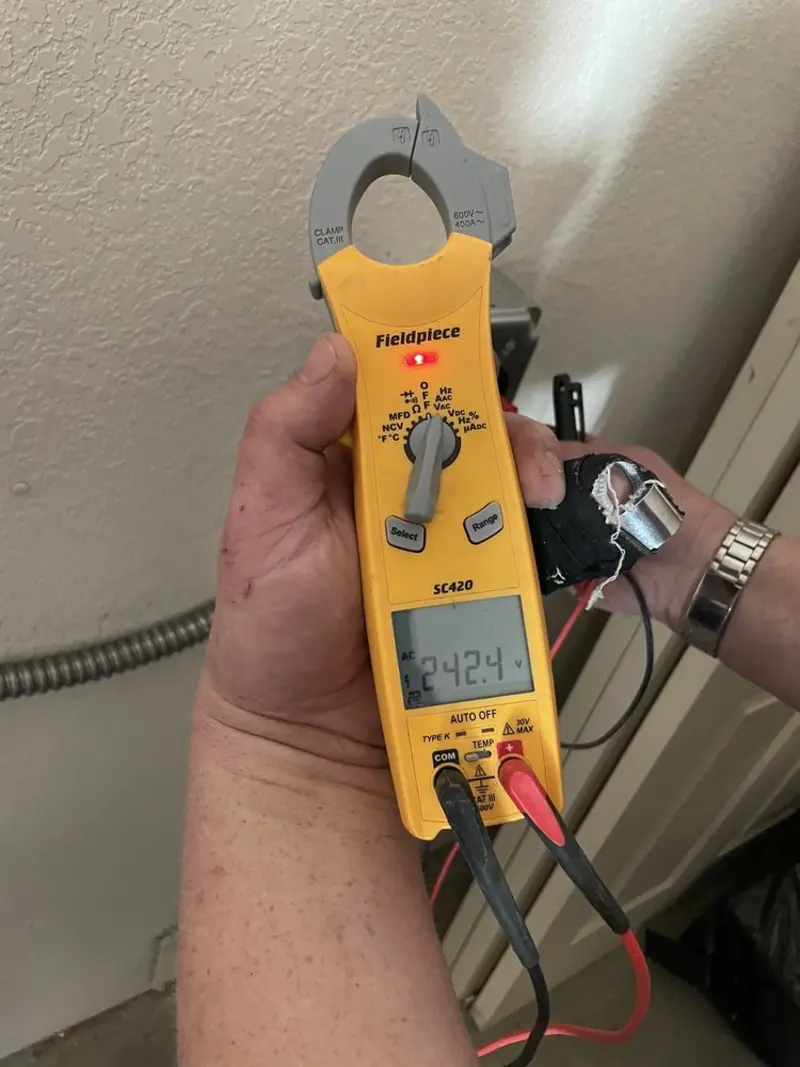 Voltage testing with clamp meter during Ceiling Fan Installation in Hampden